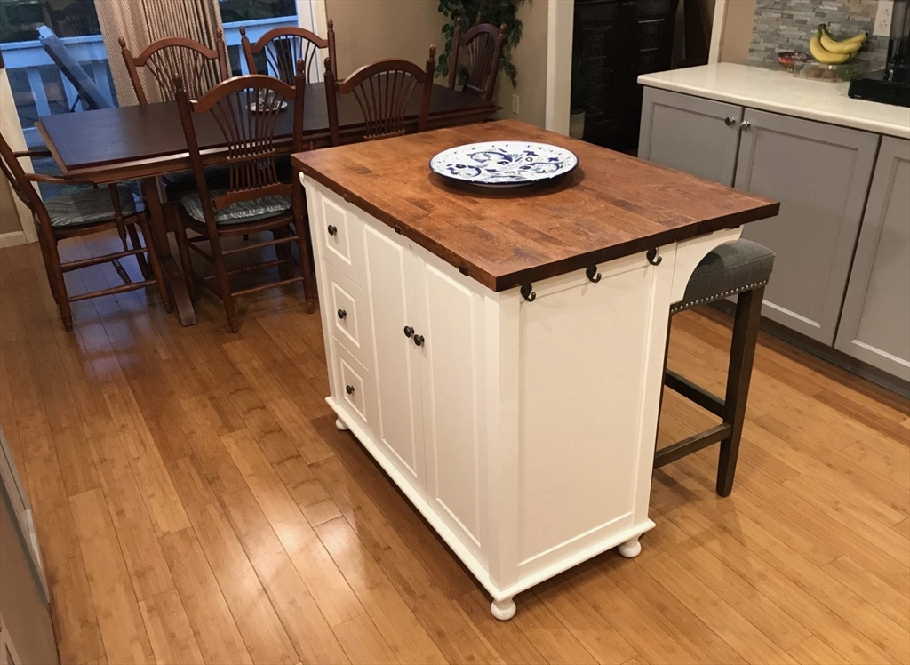 303 Lexington Street, Unit 303 Watertown, MA 02472 - Photo 10 of 13 a view of a dining room with furniture and wooden floor