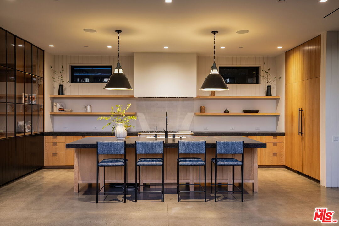 901 Flower Avenue Venice, CA 90291 - Photo 12 of 48 a kitchen with a table and chairs in it