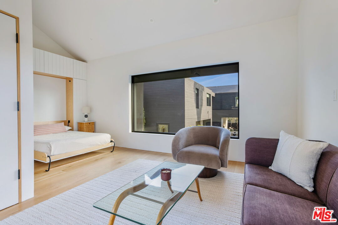 901 Flower Avenue Venice, CA 90291 - Photo 16 of 16 a bedroom with furniture and a large window