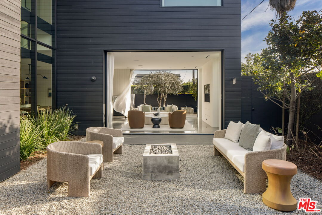 901 Flower Avenue Venice, CA 90291 - Photo 18 of 48 a view of a living room and a patio with a fountain