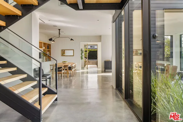 a dining table chair with a chandelier