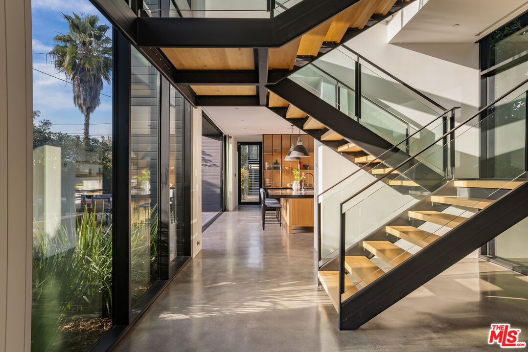 901 Flower Avenue Venice, CA 90291 - Photo 5 of 16 a view of a balcony with wooden floor and stairs