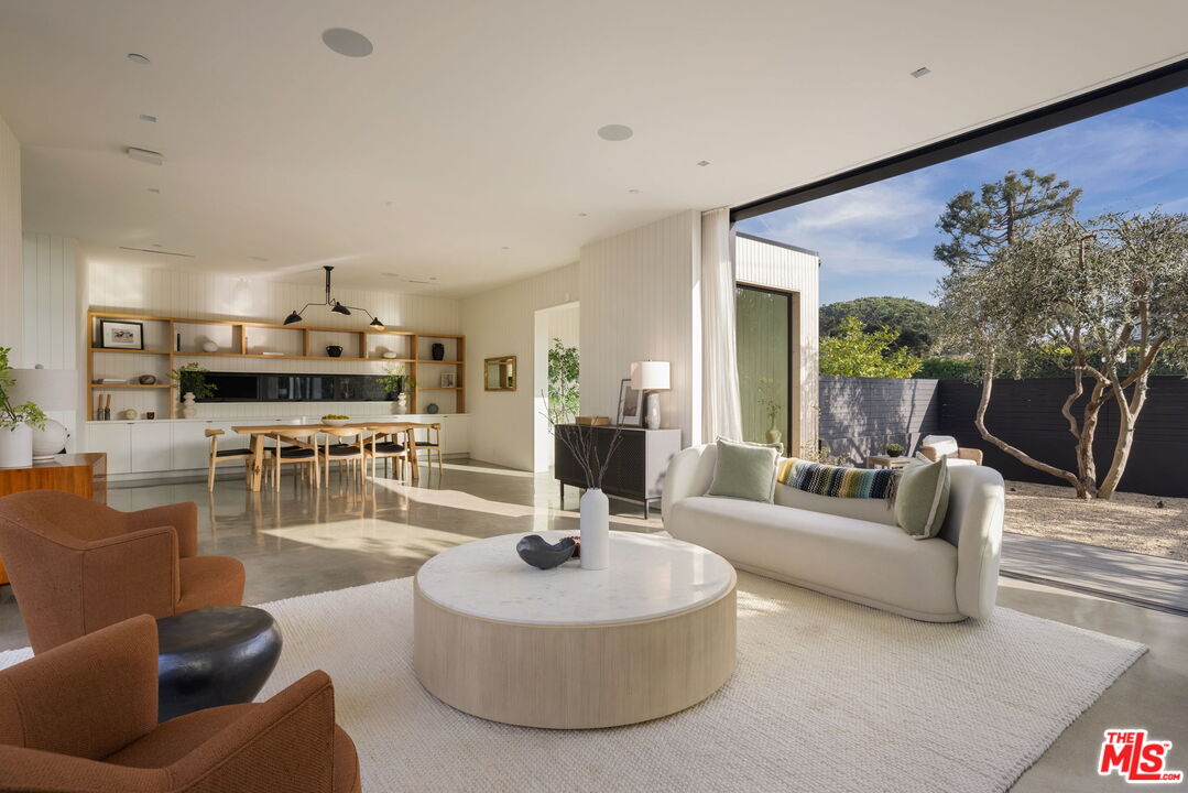 901 Flower Avenue Venice, CA 90291 - Photo 7 of 48 a living room with furniture and a large window