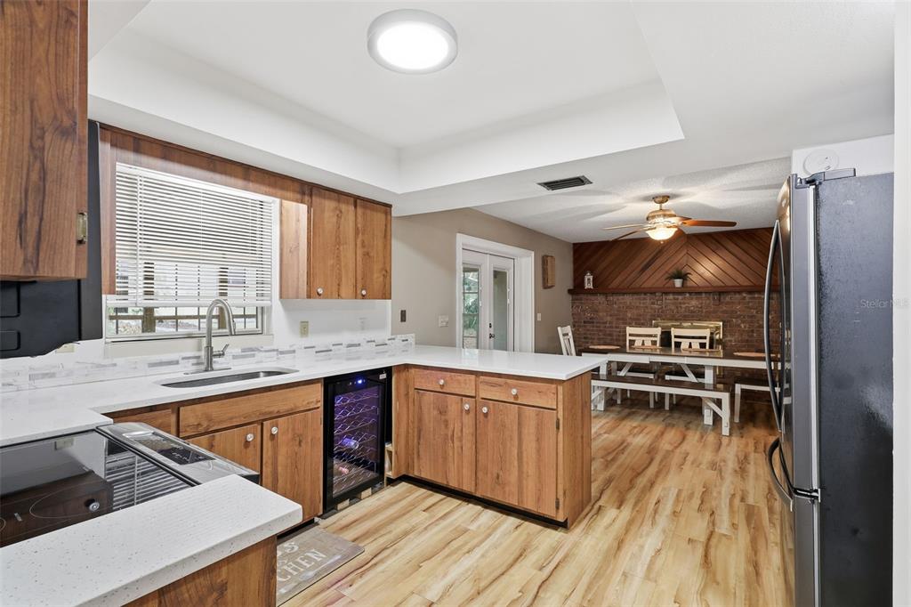 244 Angeles Road DeBary, FL 32713 - Photo 14 of 41 a kitchen with stainless steel appliances granite countertop a stove and a sink