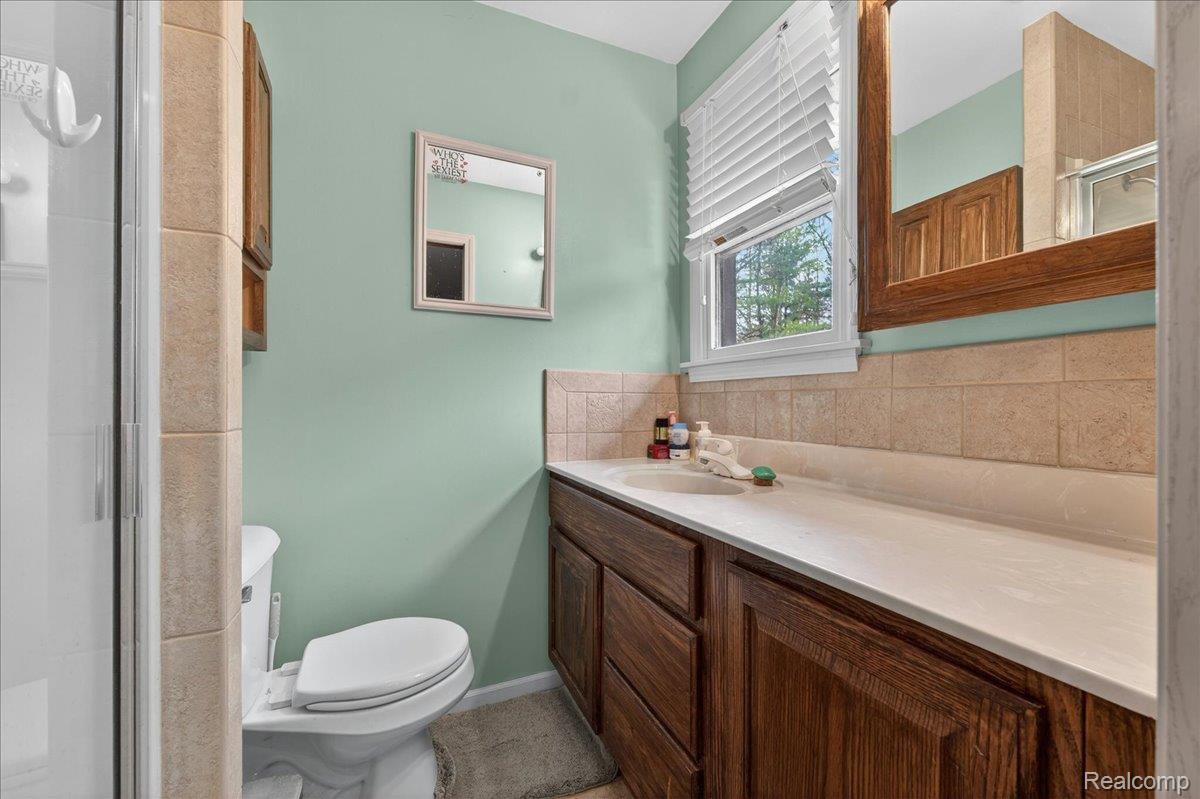 4049 Slattery Road North Branch, MI 48461 - Photo 31 of 45 Bathroom featuring a shower stall and vanity