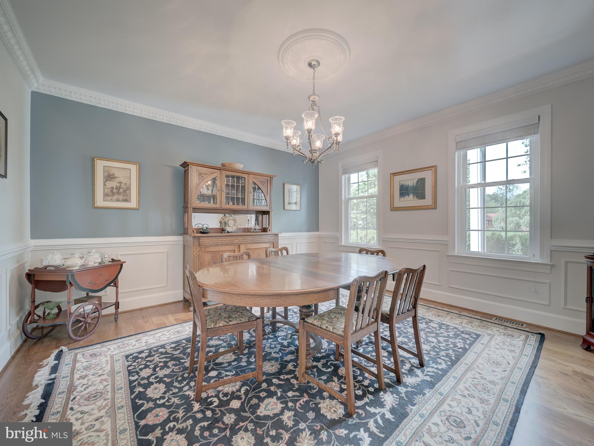 4387 Stepney Drive Gainesville, VA 20155 - Photo 11 of 74 a view of a dining room with furniture and chandelier