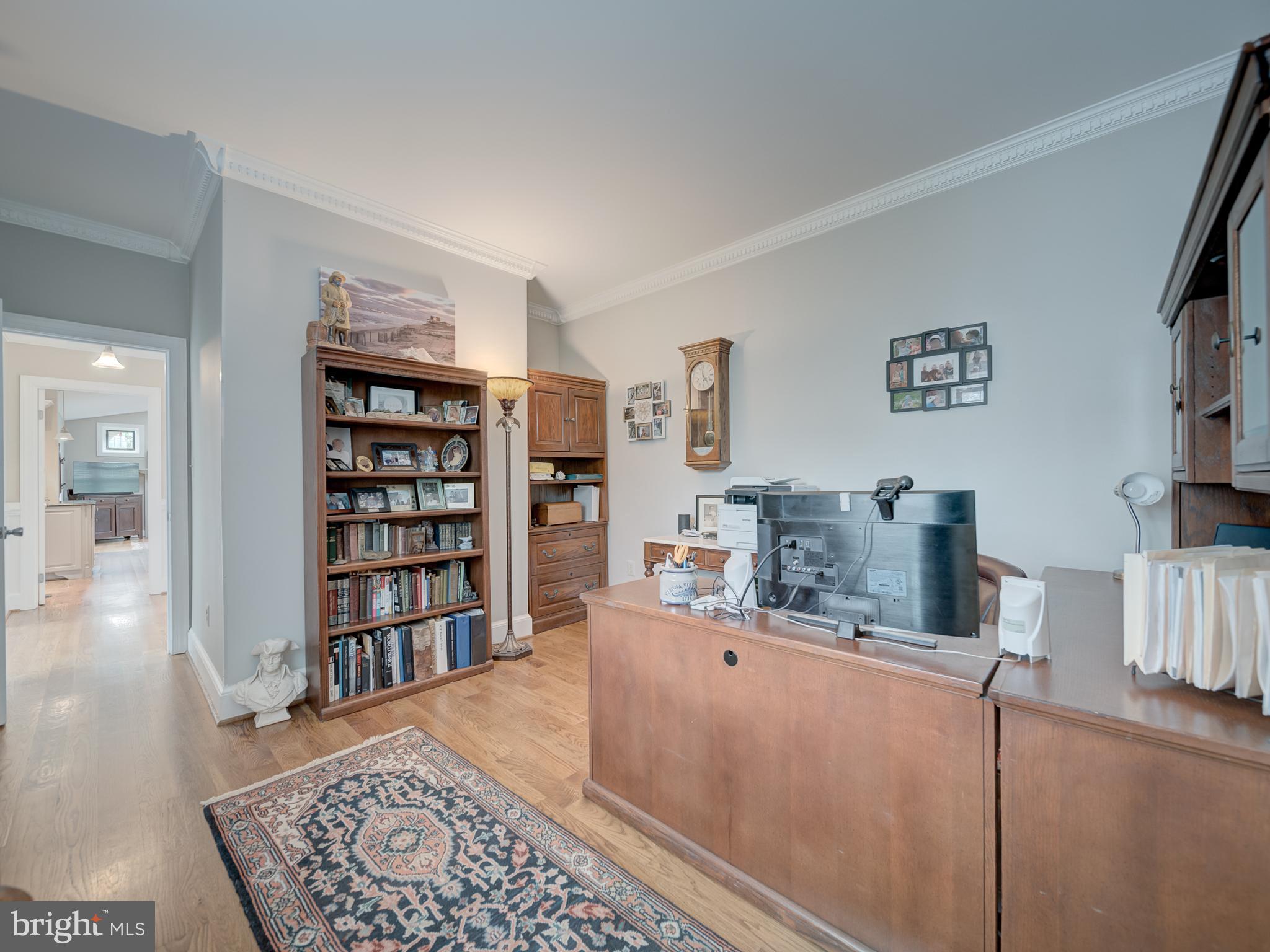 4387 Stepney Drive Gainesville, VA 20155 - Photo 20 of 74 a living room with furniture and a book shelf