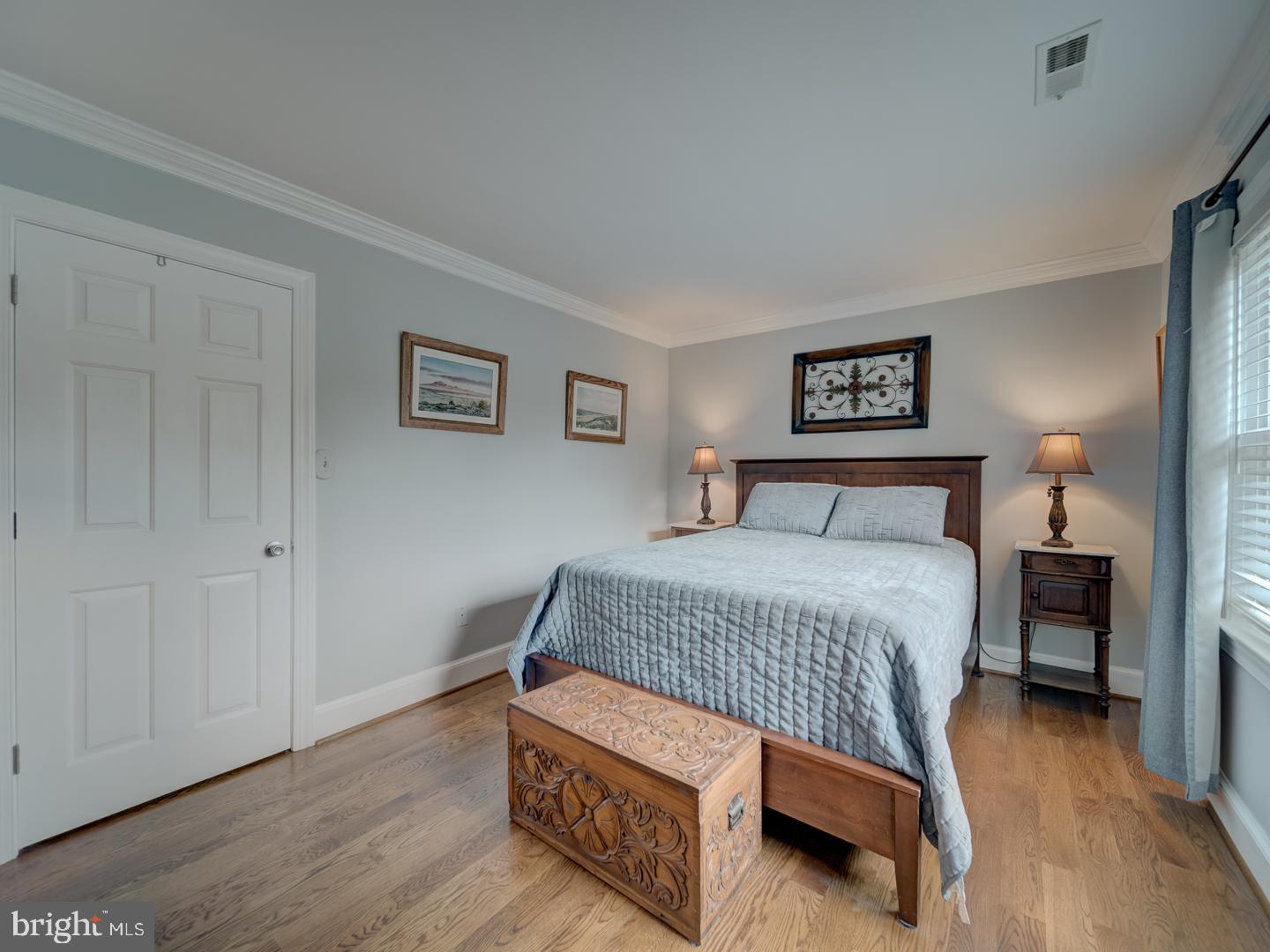 4387 Stepney Drive Gainesville, VA 20155 - Photo 46 of 74 a bedroom with a bed and a night stand
