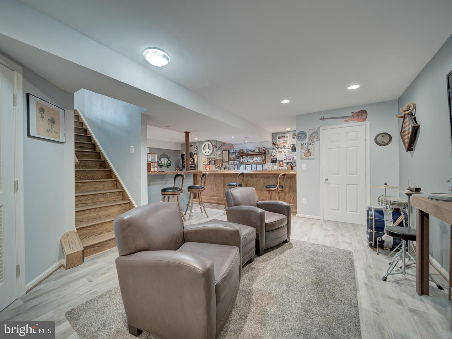 4387 Stepney Drive Gainesville, VA 20155 - Photo 54 of 74 a living room with furniture and a wooden floor