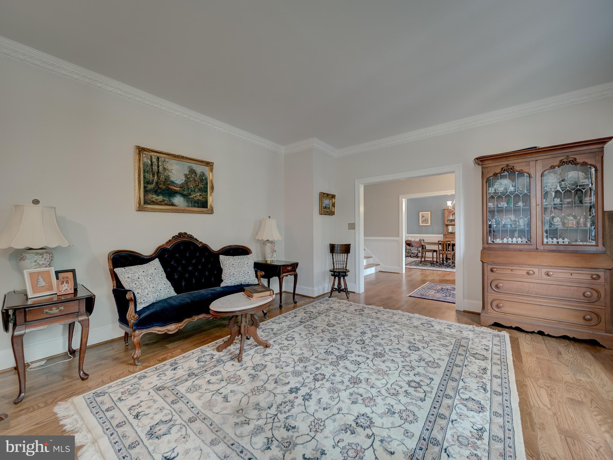 4387 Stepney Drive Gainesville, VA 20155 - Photo 7 of 74 a living room with furniture and a dresser