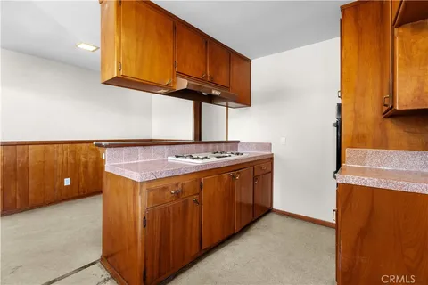 a kitchen with a stove and a microwave