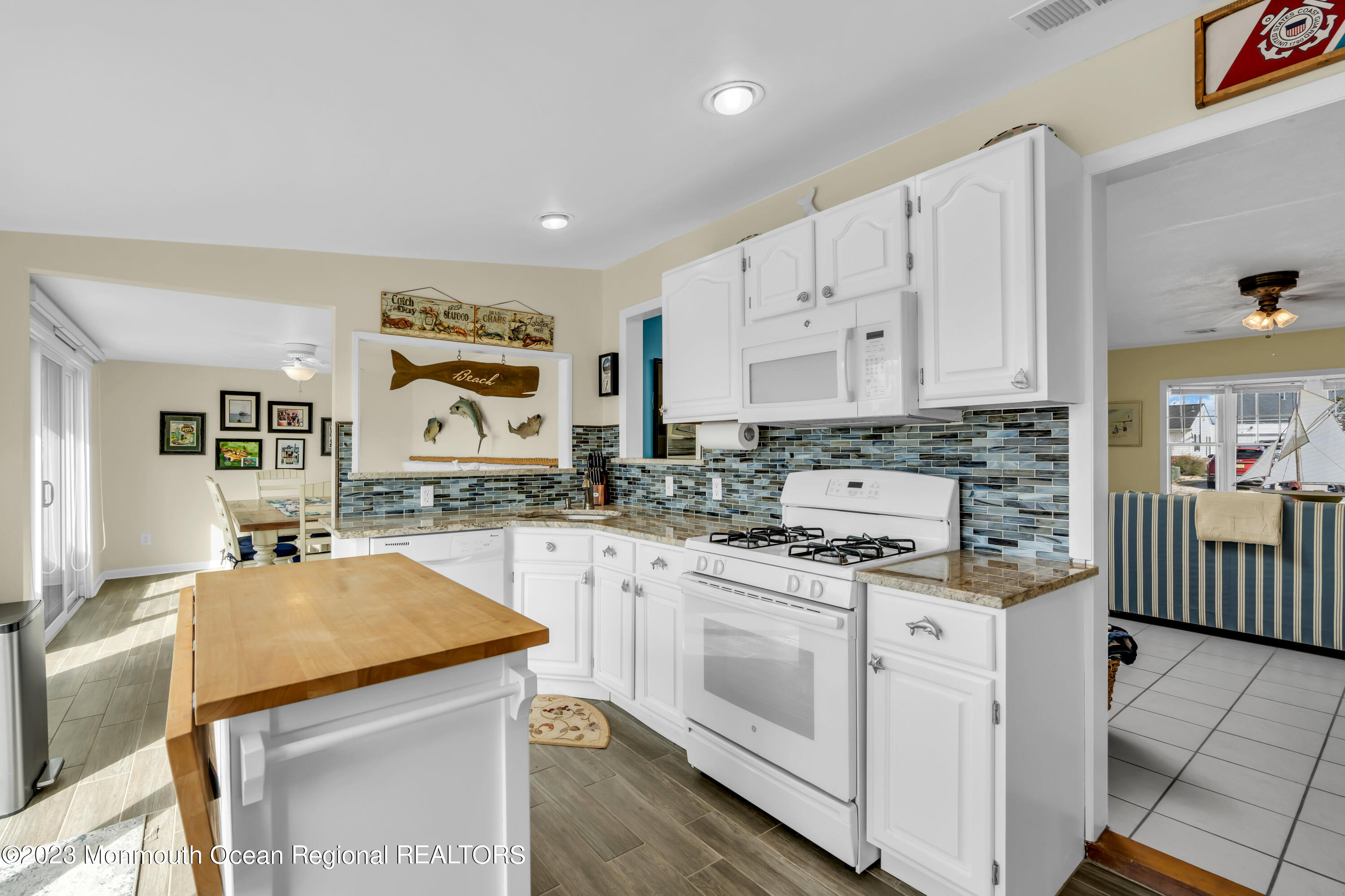 112 Newark Road Barnegat, NJ 08005 - Photo 15 of 44 a kitchen with stainless steel appliances granite countertop a sink stove and cabinets