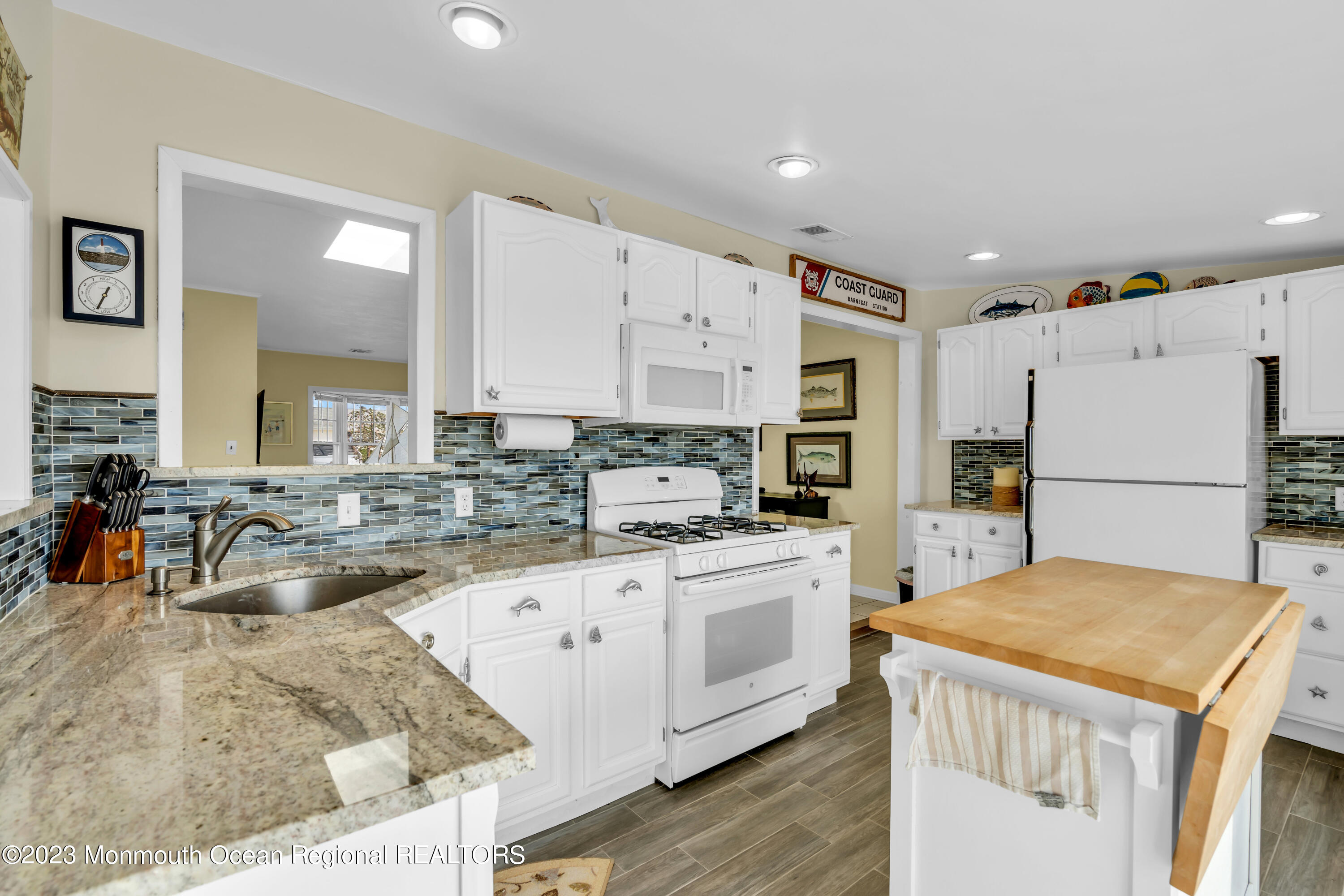112 Newark Road Barnegat, NJ 08005 - Photo 16 of 44 a kitchen with stainless steel appliances granite countertop a refrigerator a stove and white cabinets