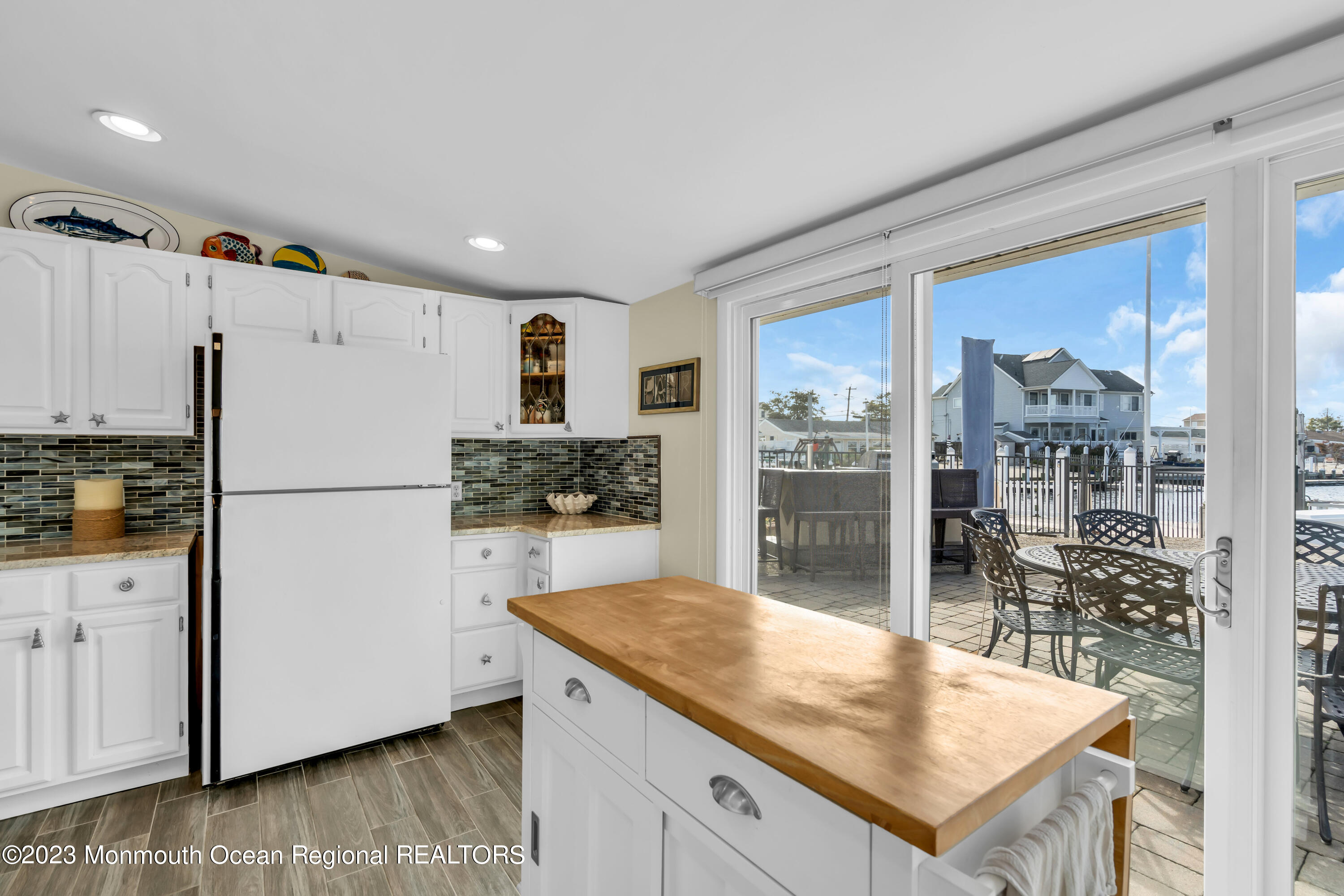 112 Newark Road Barnegat, NJ 08005 - Photo 17 of 44 a kitchen with granite countertop a refrigerator and a stove top oven