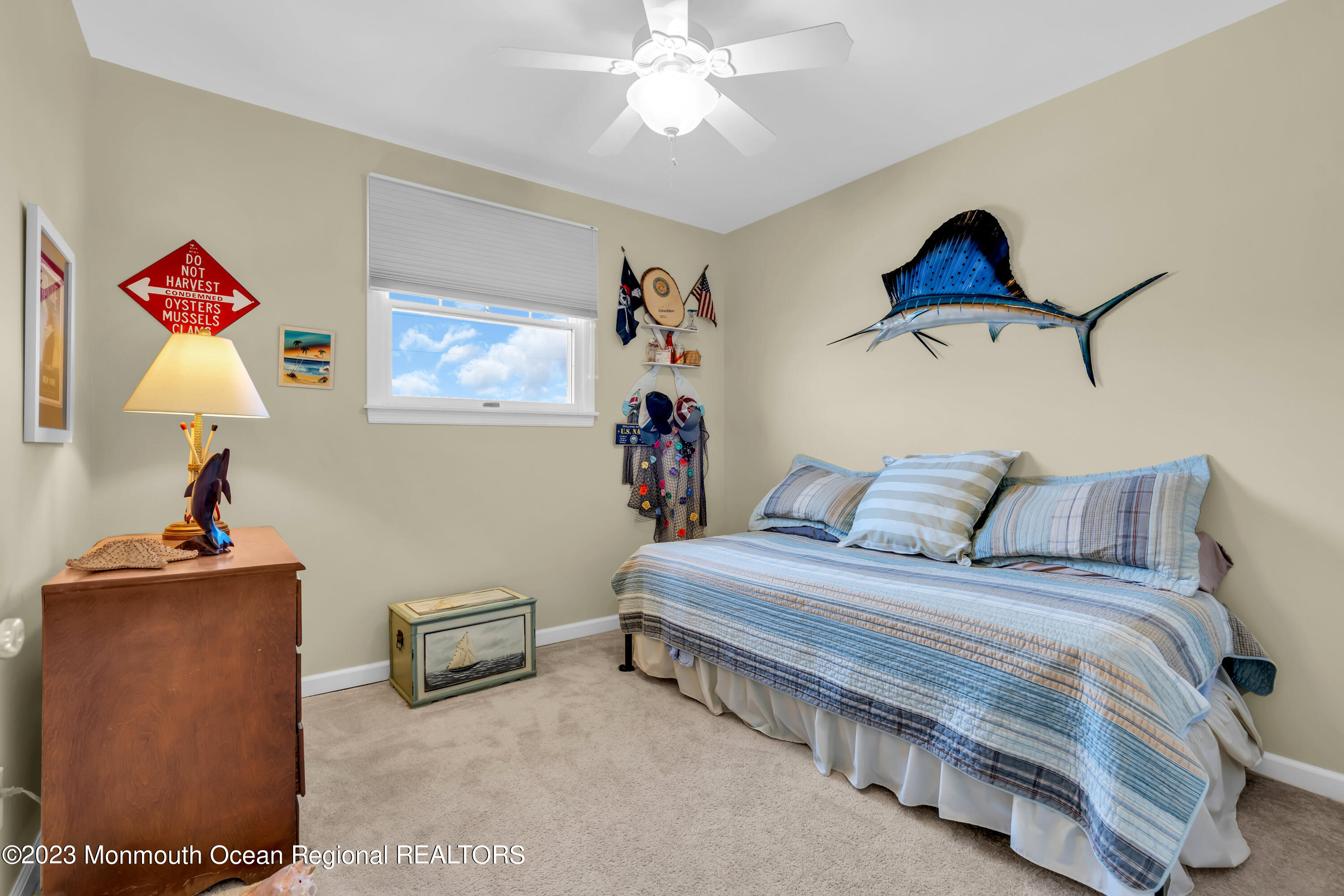 112 Newark Road Barnegat, NJ 08005 - Photo 27 of 44 a bedroom with a bed and a chandelier