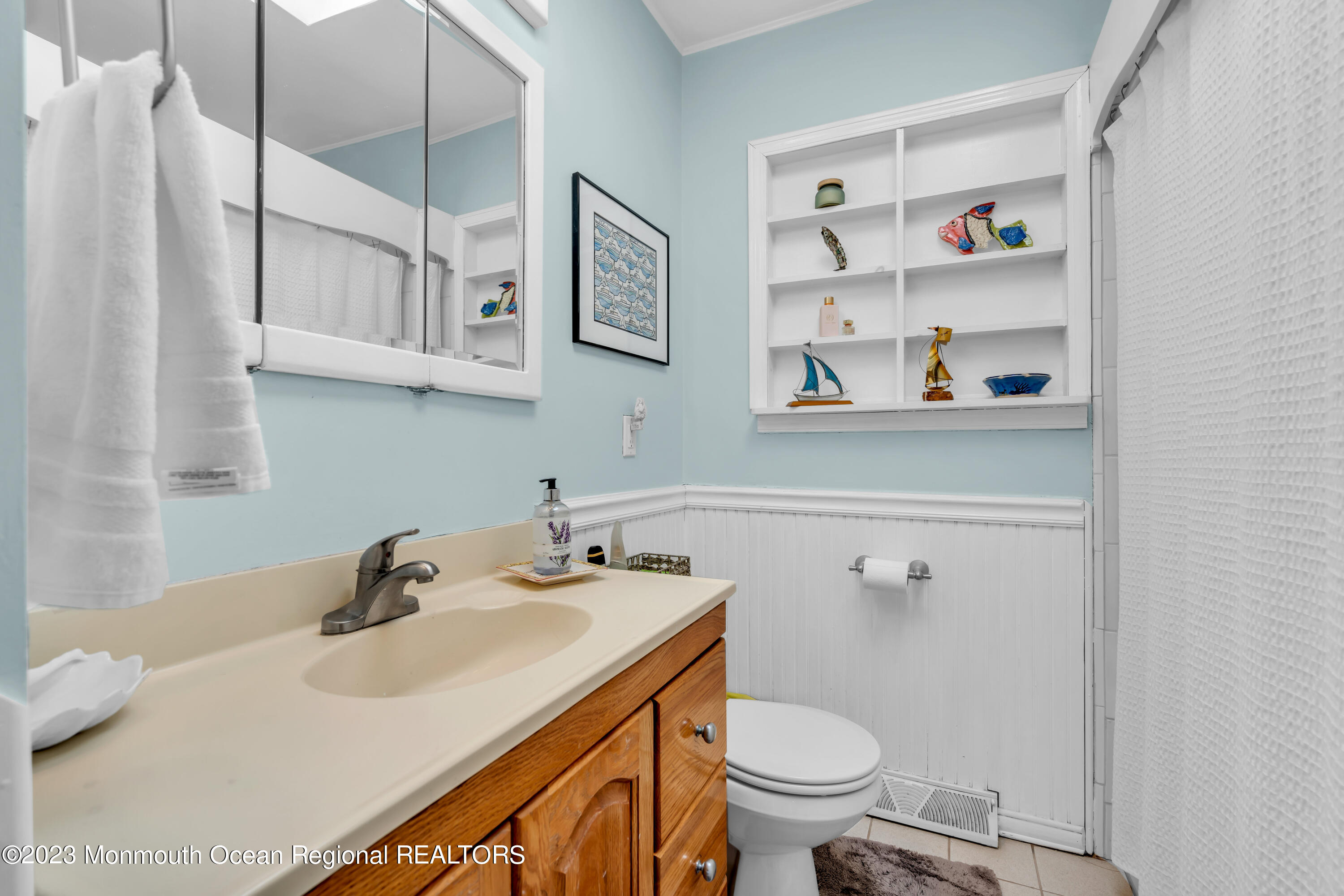 112 Newark Road Barnegat, NJ 08005 - Photo 28 of 44 a bathroom with a sink a toilet and a mirror