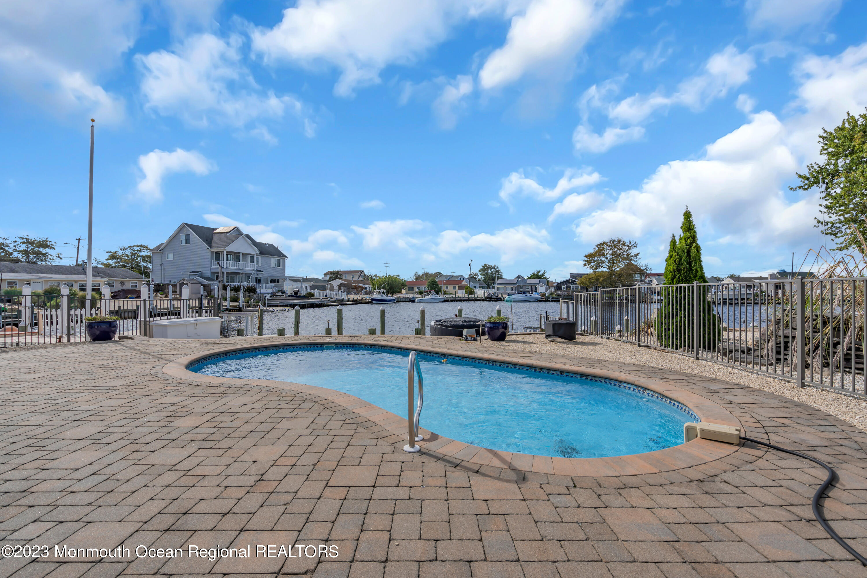 112 Newark Road Barnegat, NJ 08005 - Photo 36 of 44 a view of a swimming pool with a lounge chair