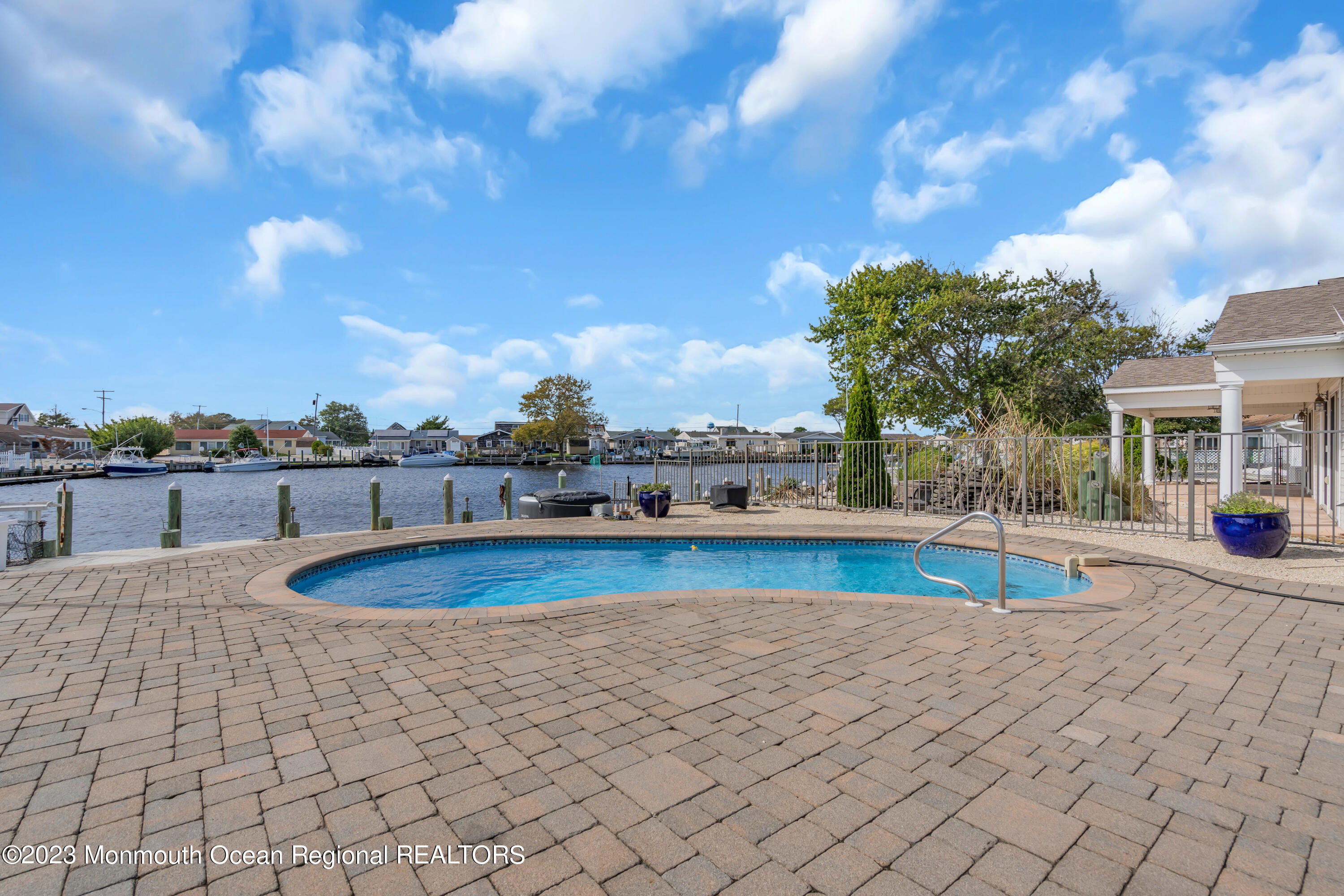 112 Newark Road Barnegat, NJ 08005 - Photo 4 of 44 a view of a swimming pool and an outdoor seating
