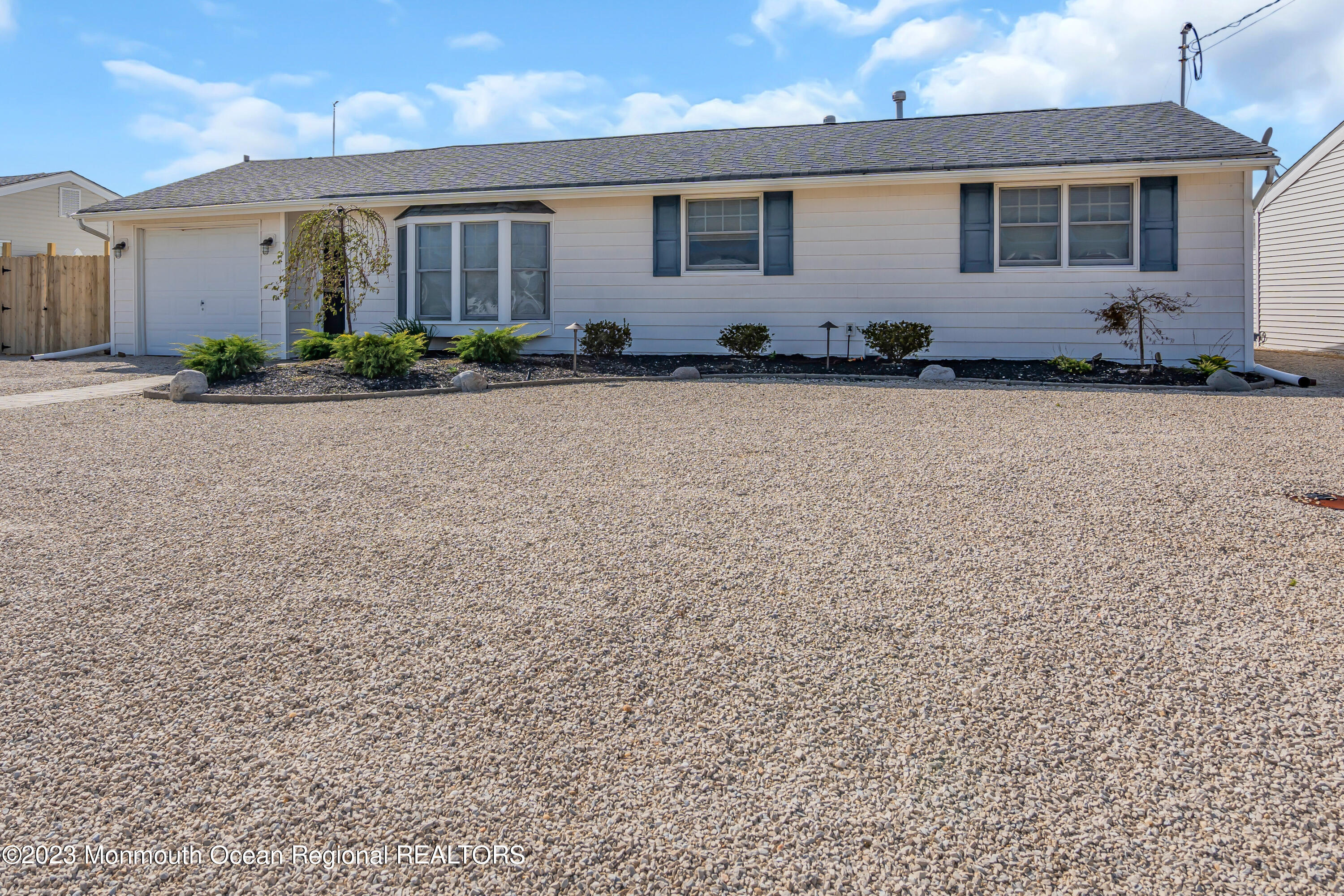 112 Newark Road Barnegat, NJ 08005 - Photo 5 of 44 a front view of a house with a garden