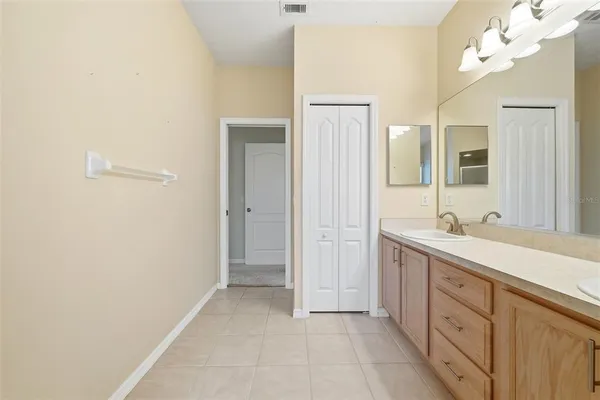 a bathroom with a sink toilet and vanity