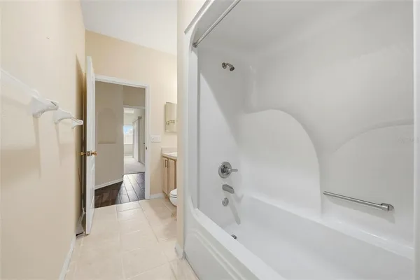 a view of a livingroom with furniture and a ceiling fan