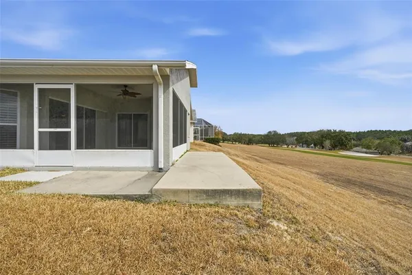 an aerial view of a house with a swimming pool