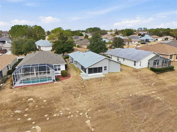 an aerial view of a house with outdoor space