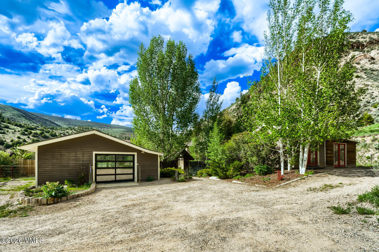 1644 Squaw Creek Road Edwards, CO 81632 - Photo 21 of 21 a front view of a house with a yard and garage