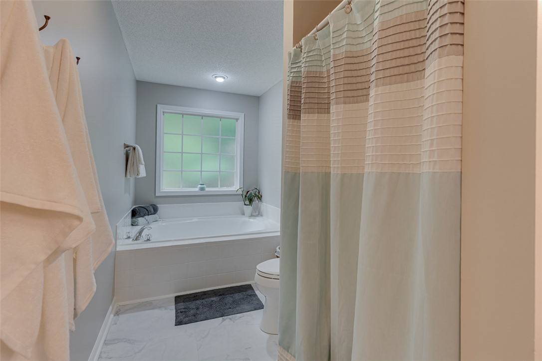 121 Crimson Leaf Lane Liberty, SC 29657 - Photo 14 of 30 This bathroom offers a large soaking tub, creating a peaceful and refreshing atmosphere for daily routines.