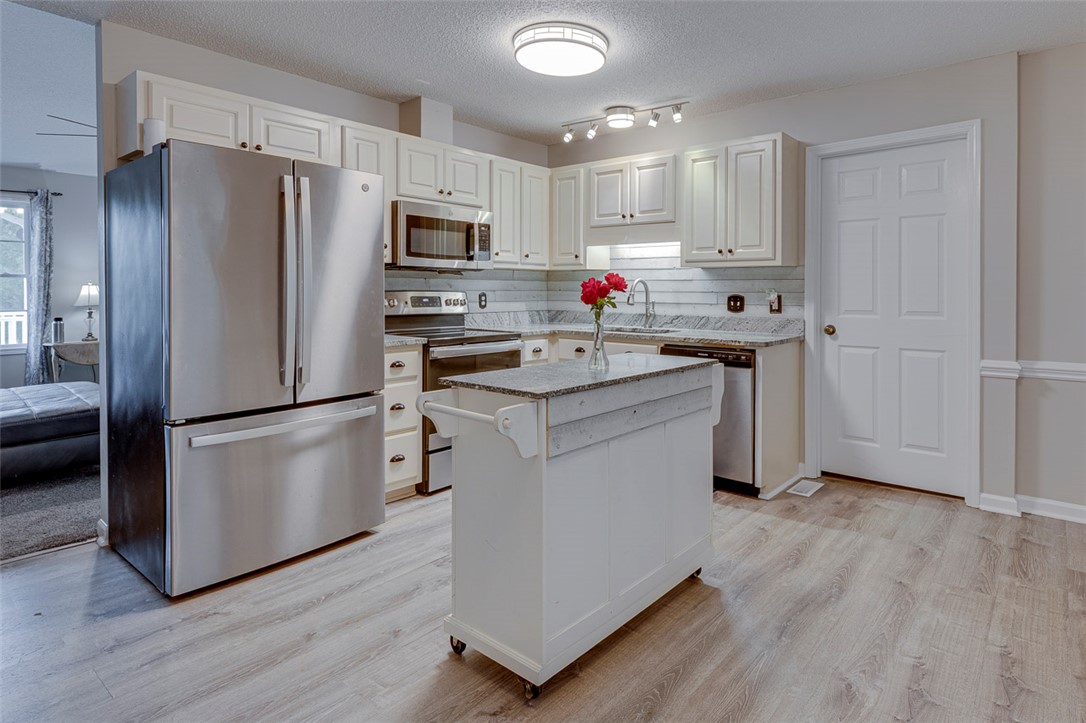121 Crimson Leaf Lane Liberty, SC 29657 - Photo 16 of 30 Bright and inviting kitchen with modern appliances, ample cabinetry, and a versatile island.