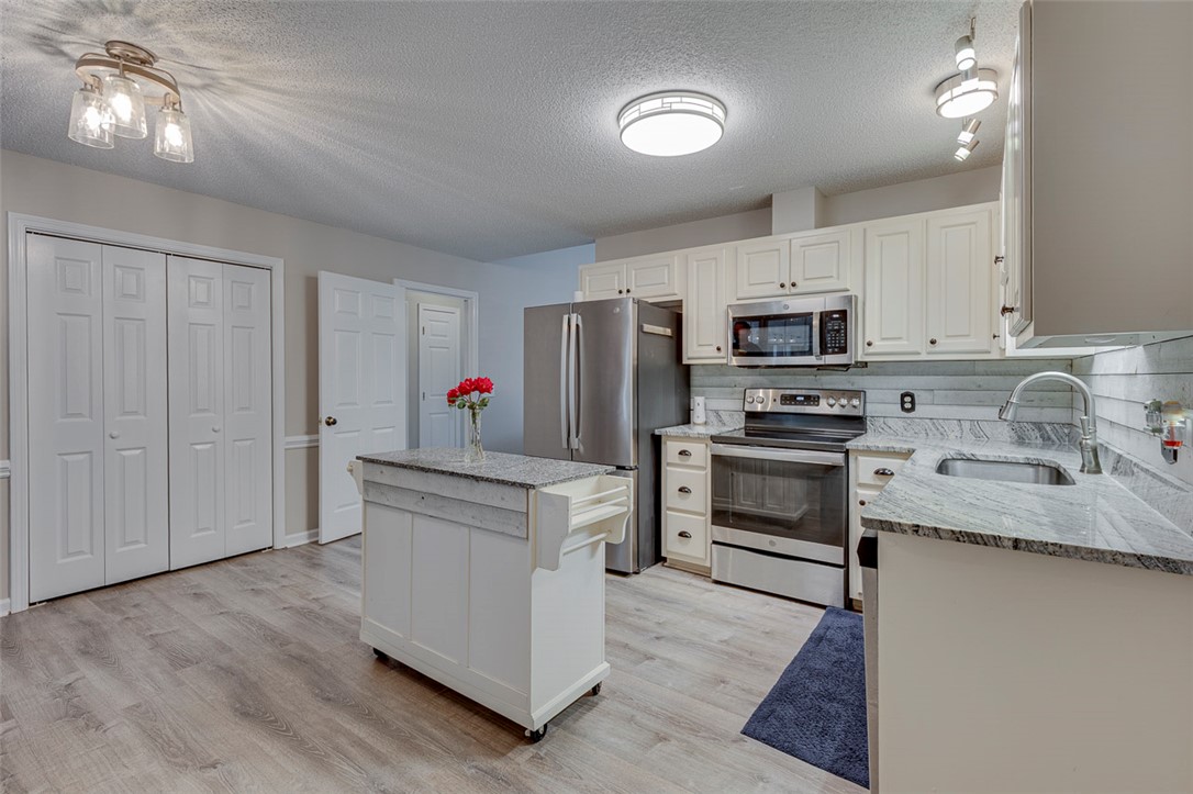 121 Crimson Leaf Lane Liberty, SC 29657 - Photo 18 of 30 This bright kitchen features modern appliances, ample storage, and durable countertops for everyday living.