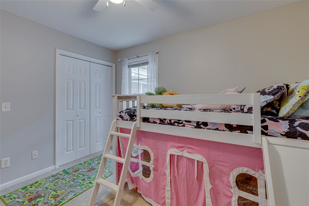 121 Crimson Leaf Lane Liberty, SC 29657 - Photo 21 of 30 This cozy bedroom features carpeted flooring and a convenient ceiling fan for comfort.
