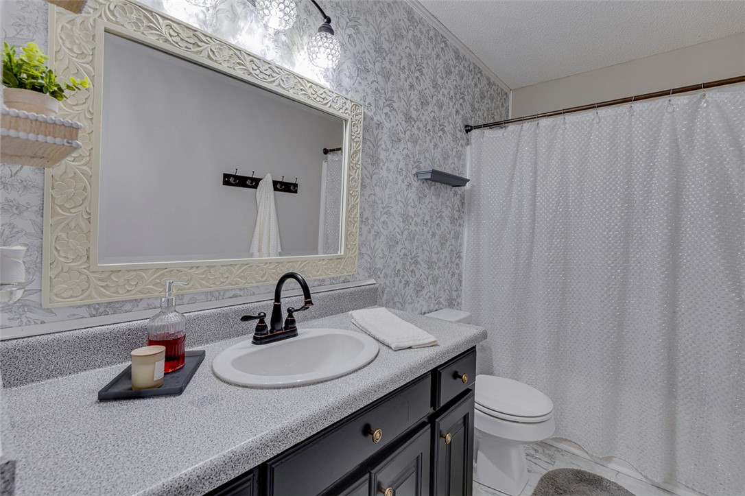 121 Crimson Leaf Lane Liberty, SC 29657 - Photo 22 of 30 This bathroom features elegant details with a functional vanity and shower area.