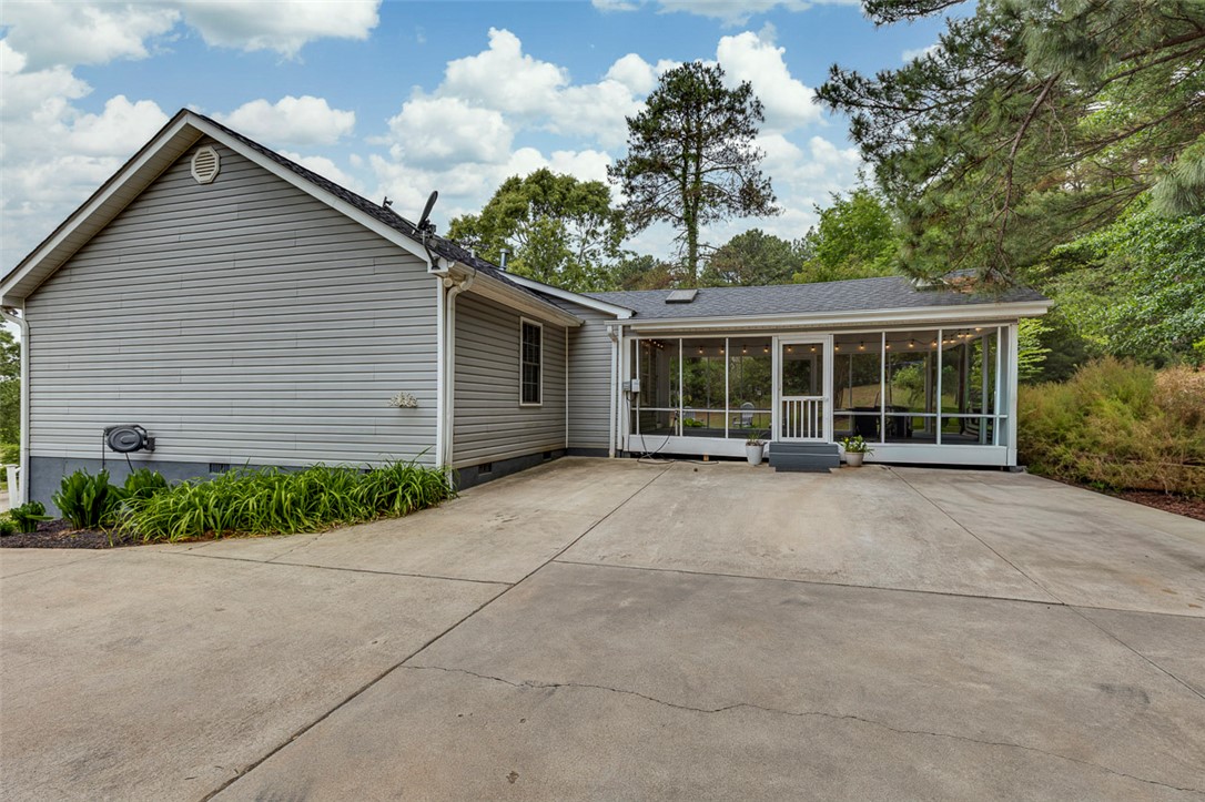 121 Crimson Leaf Lane Liberty, SC 29657 - Photo 28 of 30 This home features a screened porch and a convenient concrete driveway.