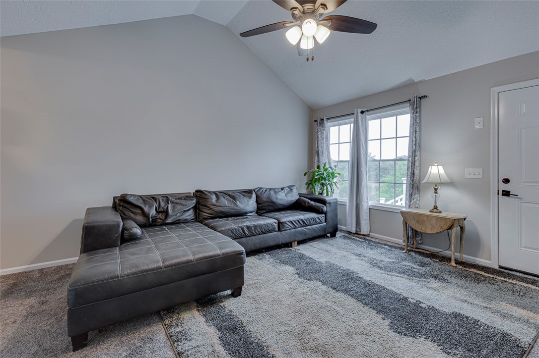121 Crimson Leaf Lane Liberty, SC 29657 - Photo 6 of 30 This living room features vaulted ceilings and ample natural light, creating an inviting atmosphere.