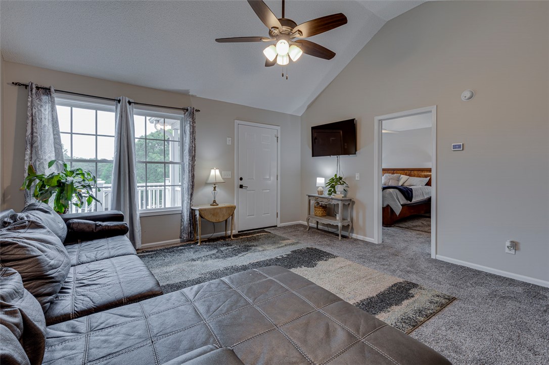 121 Crimson Leaf Lane Liberty, SC 29657 - Photo 7 of 30 This inviting living space features an open layout, vaulted ceilings, and a seamless connection to the adjacent bedroom.