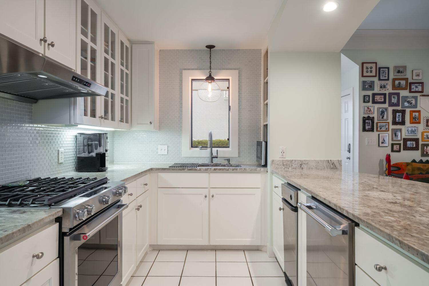 224 Rue Caribe Miramar Beach, FL 32550 - Photo 17 of 67 a kitchen with a sink stove and cabinets