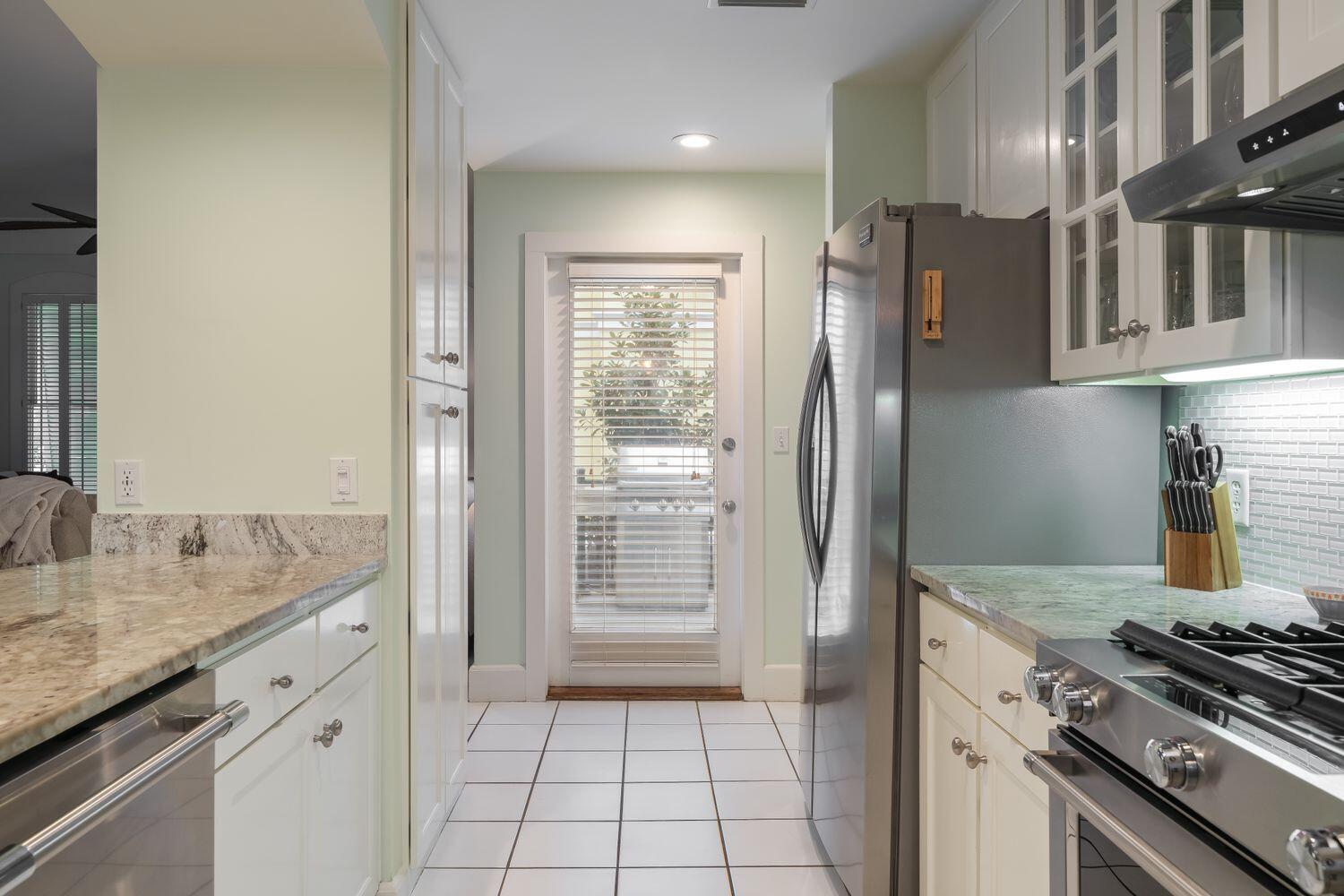 224 Rue Caribe Miramar Beach, FL 32550 - Photo 19 of 67 a kitchen with stainless steel appliances granite countertop a refrigerator and a sink