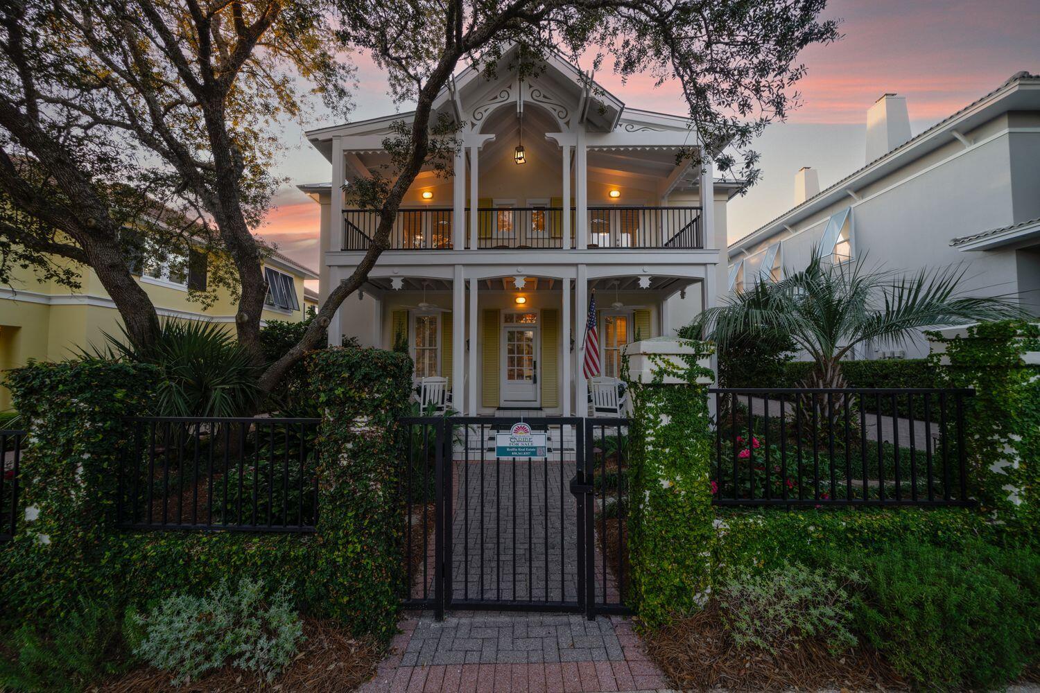 224 Rue Caribe Miramar Beach, FL 32550 - Photo 2 of 67 a front view of a house with plants and trees