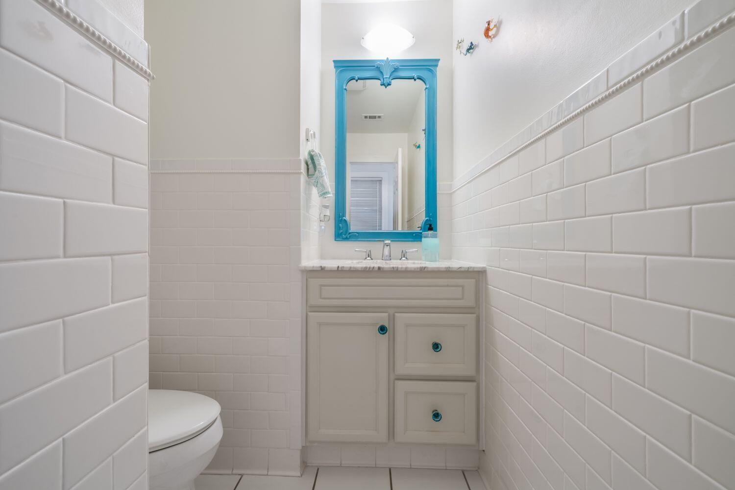 224 Rue Caribe Miramar Beach, FL 32550 - Photo 23 of 67 a bathroom with a sink a toilet and a mirror