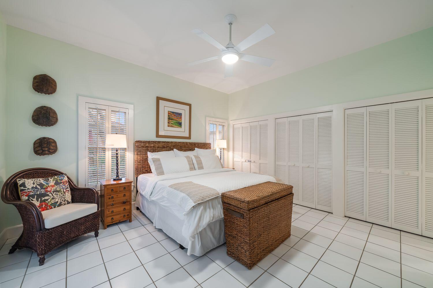 224 Rue Caribe Miramar Beach, FL 32550 - Photo 26 of 67 a spacious bedroom with a bed and a couch
