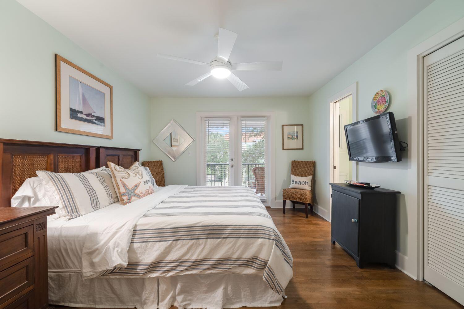 224 Rue Caribe Miramar Beach, FL 32550 - Photo 33 of 67 a spacious bedroom with a bed and a flat tv screen on the dresser