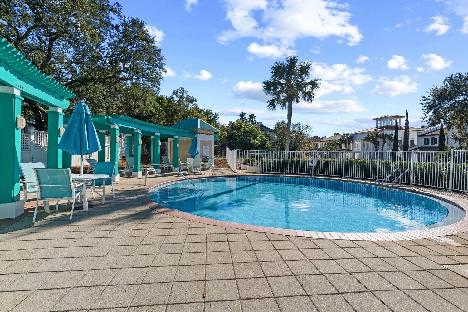 224 Rue Caribe Miramar Beach, FL 32550 - Photo 58 of 67 a view of a house with swimming pool and sitting area