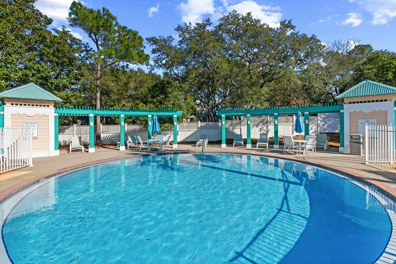 224 Rue Caribe Miramar Beach, FL 32550 - Photo 8 of 67 swimming pool view with a seating space and a garden view