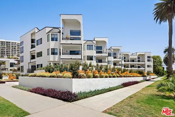 a front view of multi story residential apartment building