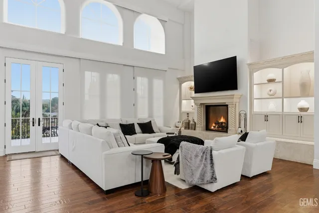 a large kitchen with stainless steel appliances granite countertop a large counter top a stove and a sink