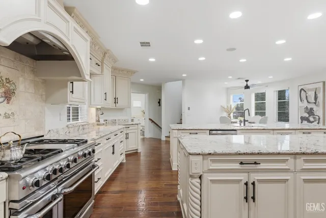 a dining room with furniture a window and wooden floor