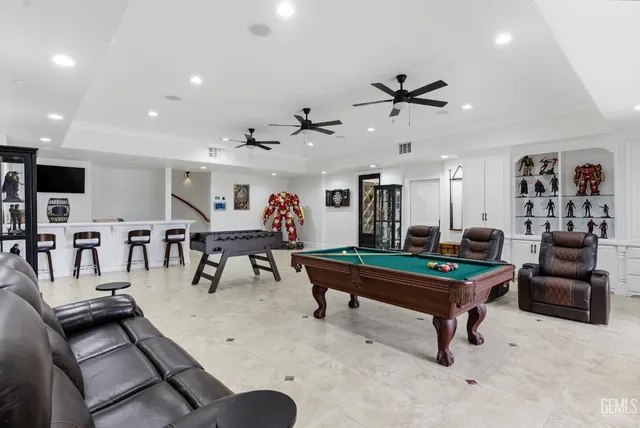 a view of a livingroom with furniture and staircase