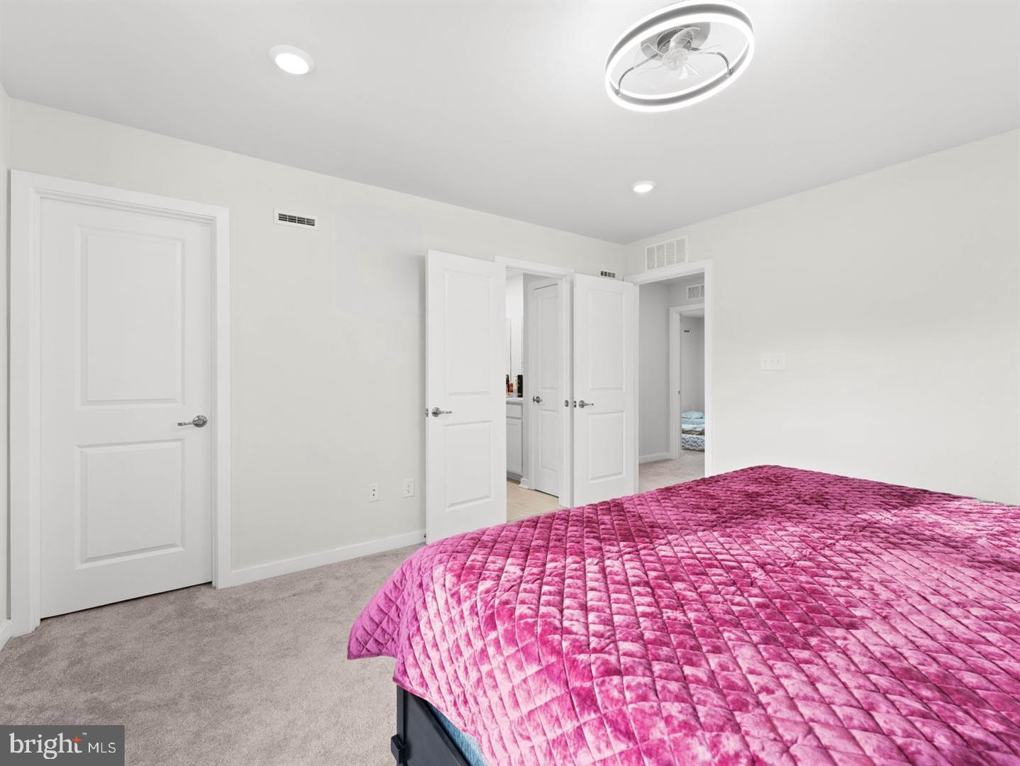 12 Handbell Lane Sicklerville, NJ 08081 - Photo 13 of 30 a bedroom with a large bed and a chandelier