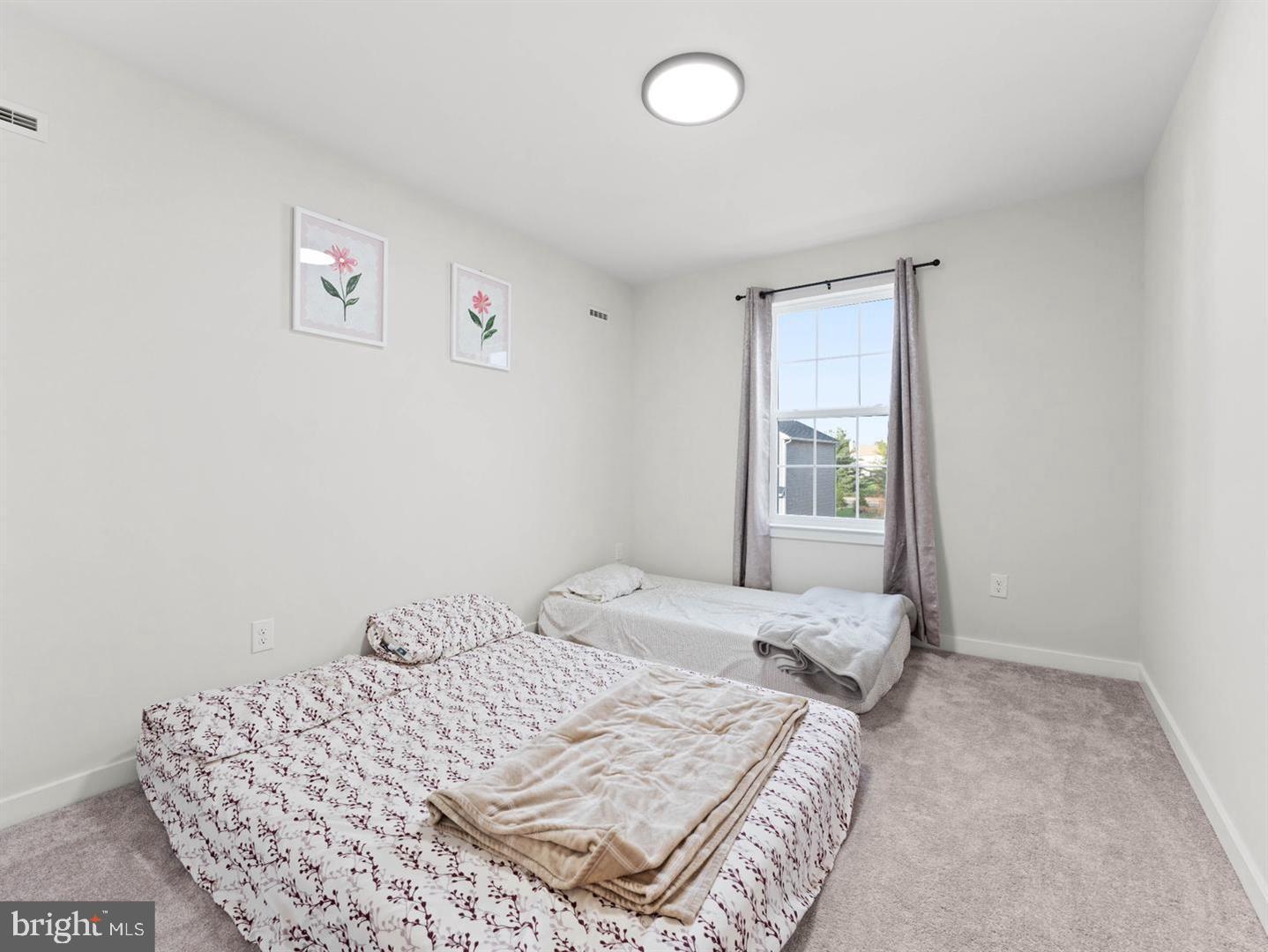 12 Handbell Lane Sicklerville, NJ 08081 - Photo 17 of 30 a bedroom with a bed and a window